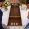 Jeu du Palet Clapet en bois en location pour animation mariage et événement dans le Loiret et sud Île-de-France