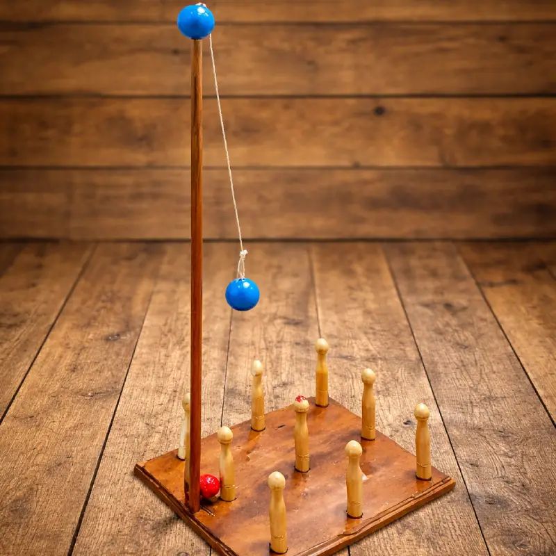 Jeu en bois Birinic géant sur fond bois pour animation de mariage, anniversaire ou événement d’entreprise, séminaire.